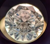 Opsydia technology advances to secure identity of melee diamonds Melee stone photographed at 50x magnification using a grading microscope. Note the three-character identifier in the centre of the table.-4